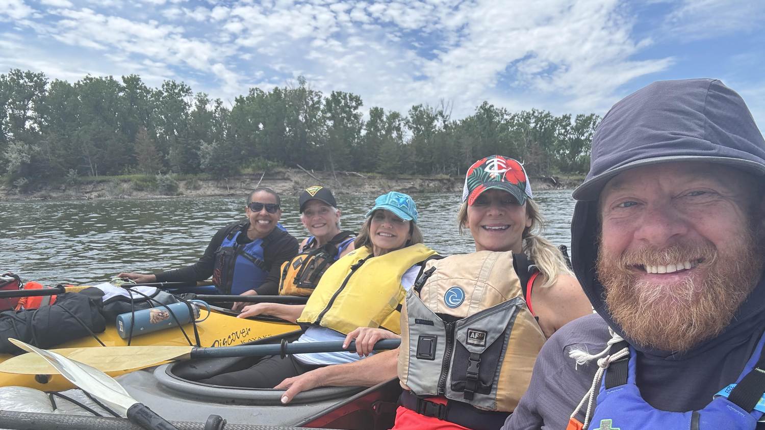 Group of kayakers paddling the free-flowing Missouri River